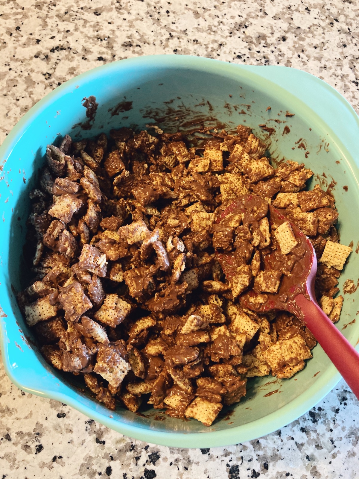 Puppy Chow made with chocolate chips, butter, and peanut butter